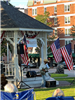 Willie J Laws playing a guitar in front of the gazebo